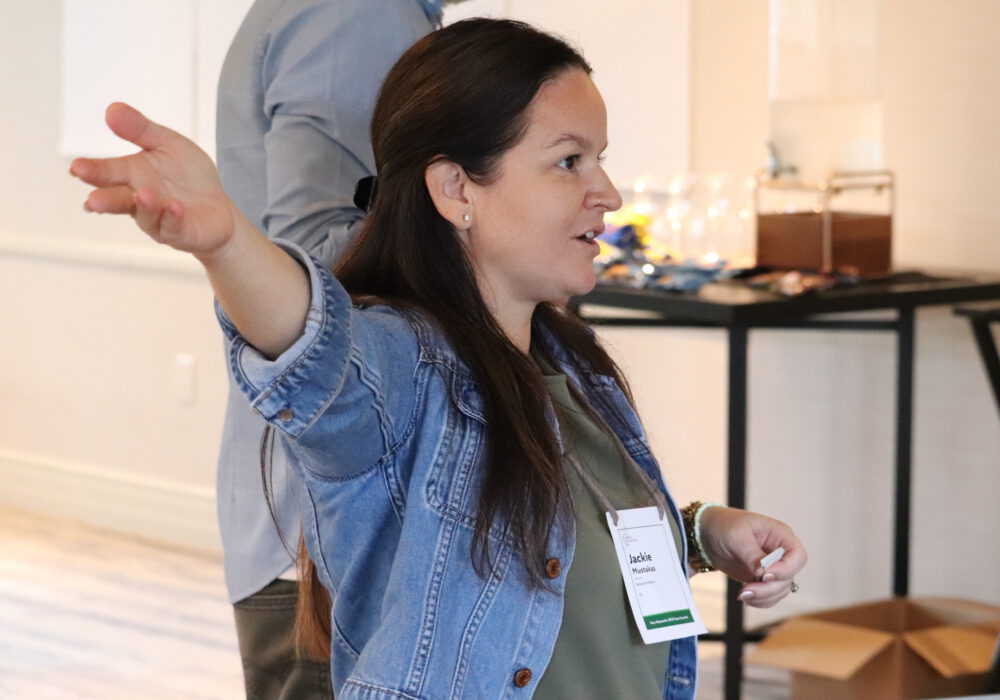 Woman gesturing to make a point at 2025 Super Summit