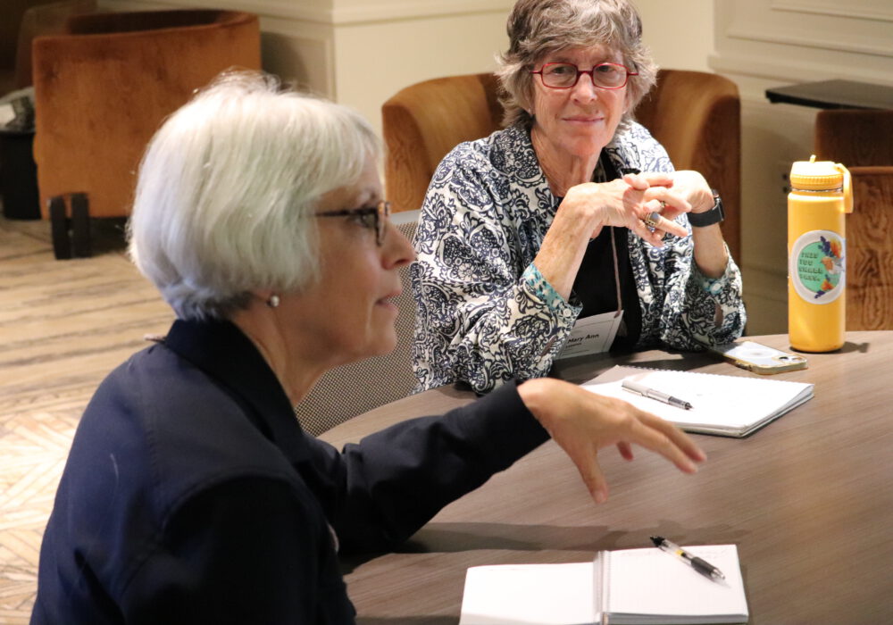 Two women at table during 2025 Super Summit