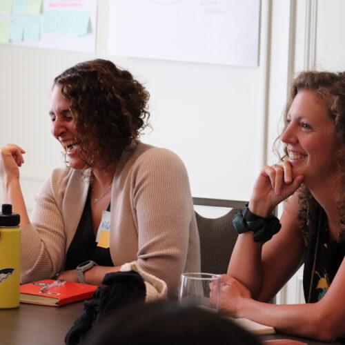 Two women Summit participants laughing at 2025 Super Summit